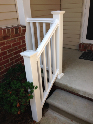 white handrail in the front of a house