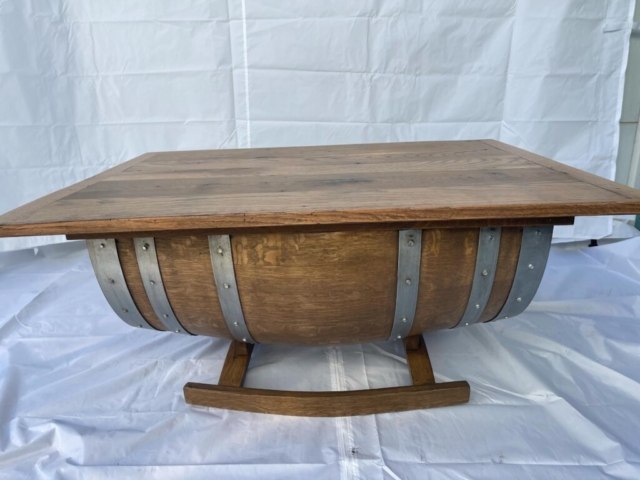 table made from weathered wood and whiskey barrel